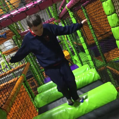 Ceara Special School visit to High Rise Lisburn. Young boy playing in soft play area.