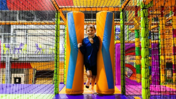 Young boy running through soft play area at High Rise Lisburn