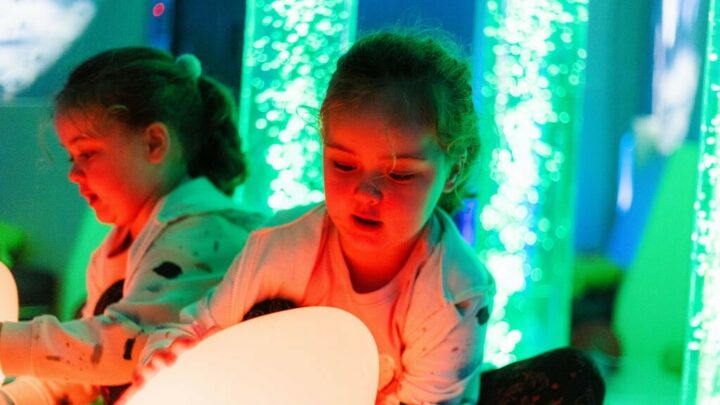 Young girl playing with the sensory egg light in the sensory rooms at High Rise Lisburn