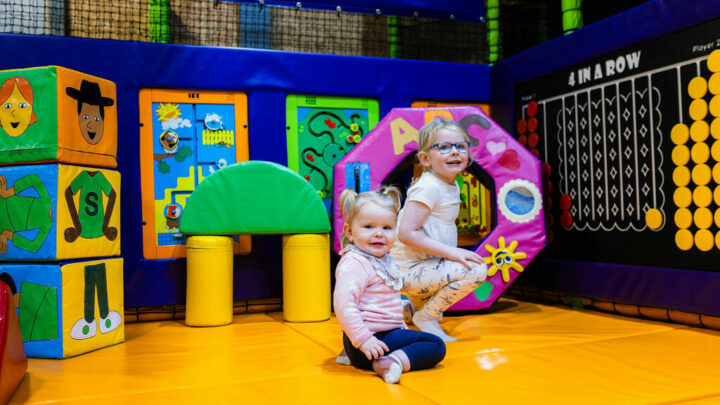 Little girls playing in the bright and colourful soft play area at High Rise Lisburn