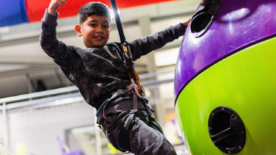 Young boy giving the thumbs up on a climbing challenge at High Rise Lisburn