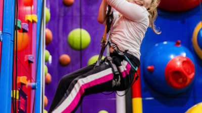 Young girl smiling on climbing walls at High Rise Lisburn (1)